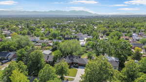 Aerial view of residential area featuring mountains