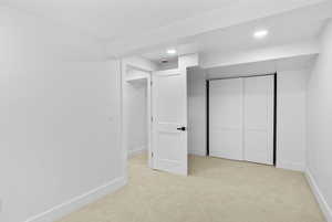 Unfurnished bedroom featuring recessed lighting, baseboards, and carpet floors