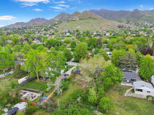Aerial perspective of suburban area with a mountainous background