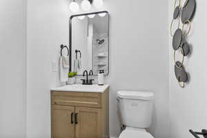 Bathroom with toilet and vanity