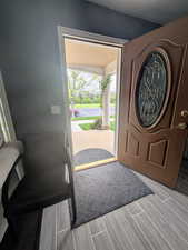 Entryway with wood finished floors