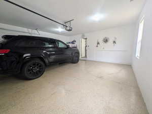 Garage featuring a garage door opener