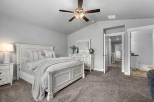 Bedroom with light carpet, lofted ceiling, baseboards, and visible vents