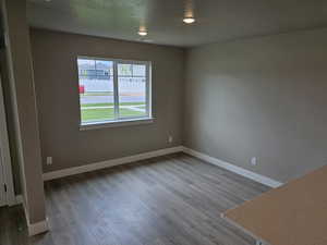 Empty room with wood finished floors and baseboards