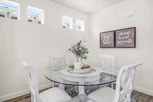 Dining room featuring baseboards and wood finished floors