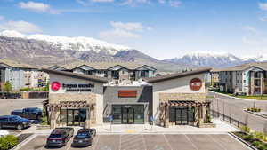 View of property featuring uncovered parking and a mountain view