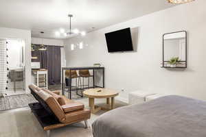Bedroom featuring baseboards and carpet floors