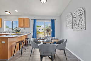 Dining room featuring recessed lighting, baseboards, and wood finished floors