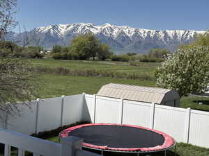 View of mountain background featuring rural landscape