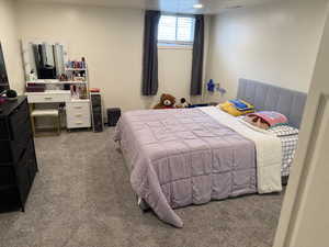 Carpeted bedroom with visible vents