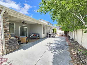 View of patio / terrace with an outdoor hangout area, a ceiling fan, outdoor dining area, and a fenced backyard