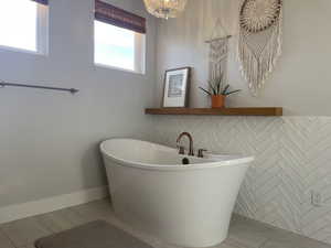Full bathroom with a soaking tub