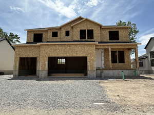 Property in mid-construction with an attached garage