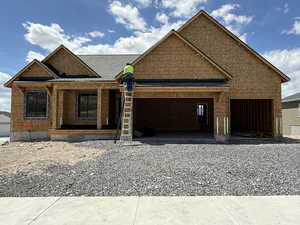 Property in mid-construction with a garage