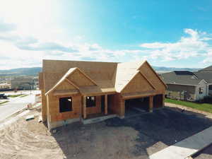 Property in mid-construction with covered porch