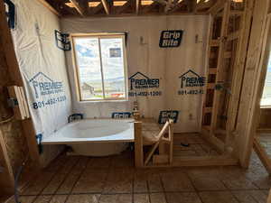 Full bath featuring a bath