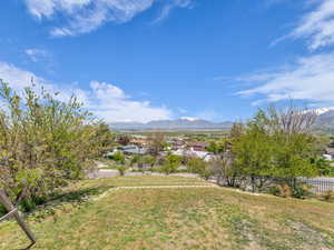 Exterior space with a mountain view and fence