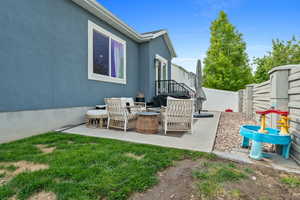 View of patio with a fenced backyard