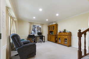 Office featuring light colored carpet, crown molding, baseboards, and recessed lighting