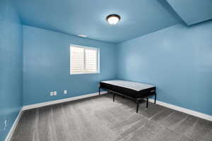 Bedroom featuring carpet floors, baseboards, and visible vents