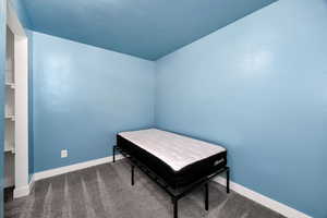 Office space with carpet flooring and baseboards