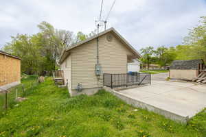 View of property exterior with fence