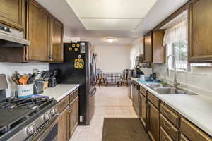 Kitchen featuring stainless steel appliances.  NEW FLOORS ENTIRE HOUSE