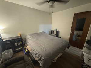 Bedroom featuring wood finished floors and ceiling fan