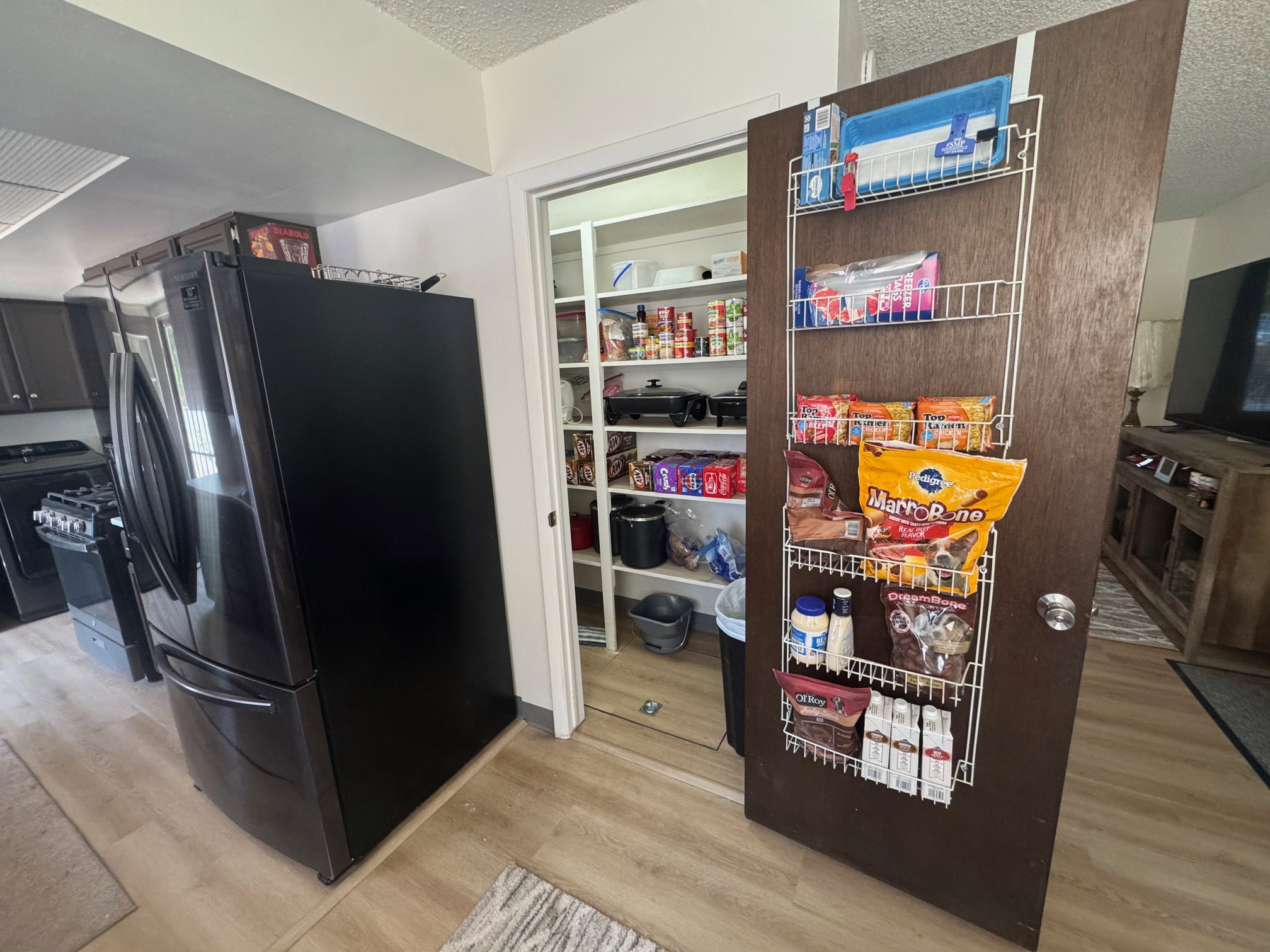 Large walk in pantry with new flooring and paint.