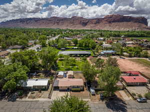 Aerial perspective of suburban area with a mountain backdrop
