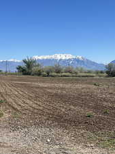 View of mountain background featuring rural landscape