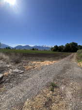 View of mountain background featuring rural landscape