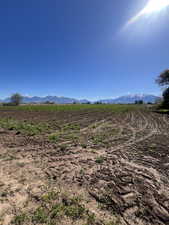 View of mountain background featuring rural landscape