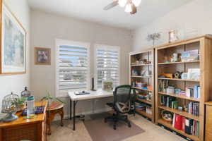 Office area featuring carpet flooring and ceiling fan