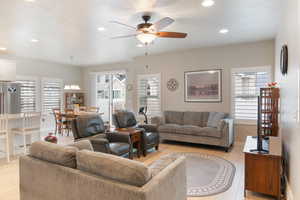 Living area with ceiling fan, recessed lighting, light wood-type flooring, and baseboards