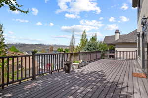 Wooden deck featuring a mountain view
