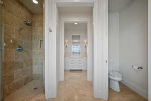 Full bathroom with toilet and a shower stall