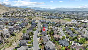 Birds eye view of property with a mountain view and a residential view