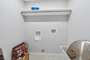 Laundry room with laundry area, hookup for an electric dryer, baseboards, and hookup for a washing machine