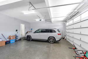 Garage featuring a garage door opener