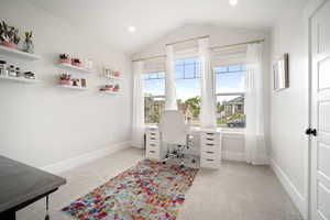 Office area featuring lofted ceiling, light carpet, recessed lighting, and baseboards
