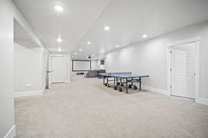 Game room featuring baseboards, visible vents, recessed lighting, and light colored carpet