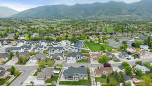 Drone / aerial view featuring a mountain view and a residential view