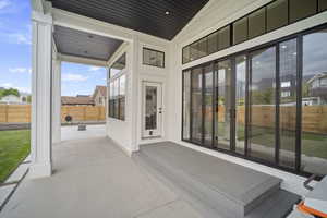 View of patio with fence