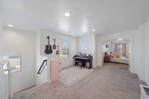Carpeted bedroom with visible vents and recessed lighting