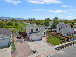Aerial perspective of suburban area with a mountainous background