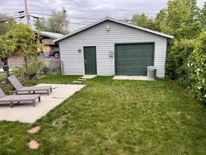 Detached garage featuring fence