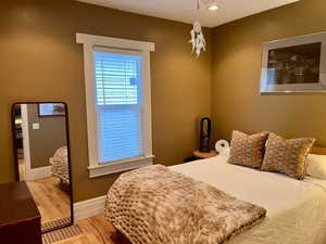 Bedroom with recessed lighting, baseboards, and wood finished floors