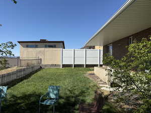 View of yard featuring a fenced backyard