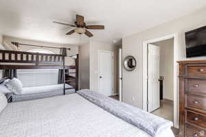 Bedroom featuring baseboards and a ceiling fan